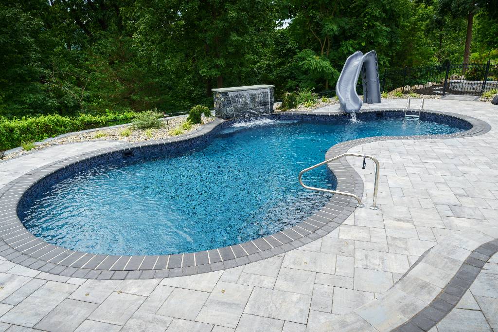 In-ground pool with elegant landscaping